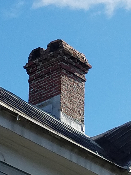 a brick chimney with arches